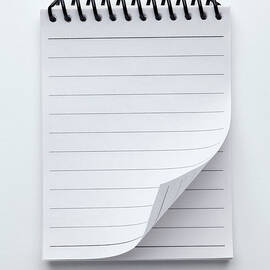 A Spiral Notepad With Lined Paper And A by Caspar Benson