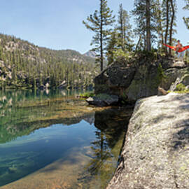 Female Hiker Relaxing In Hammock by Matt Andrew