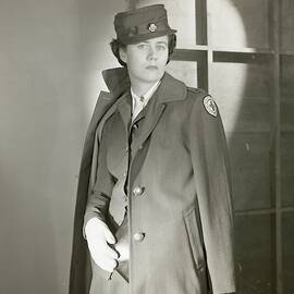 Portrait Of Katherine Blake In Her Red Cross by Horst P. Horst
