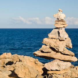 Stack of rocks on coast of Kauai by Steven Heap