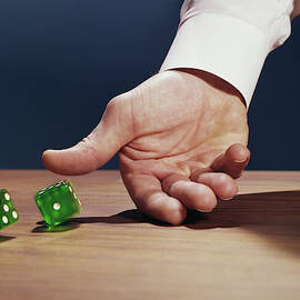 1960s Male Hand Rolling Dice Hand by Vintage Images