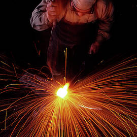 1980s Blacksmith Working White Hot Iron by Vintage Images