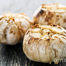 Roasted garlic bulbs 1 by Elena Elisseeva