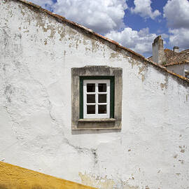 Rustic Green Window against a Whitewashed Wall with a Yellow Border by David Letts