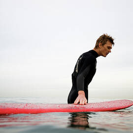 A Surfer Enjoys The Waves In Carlsbad by Jay Reilly