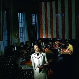 A Model In Front Of An American Flag by Horst P. Horst