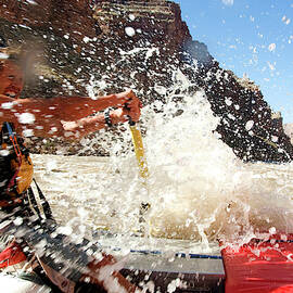 A River Guide Rows Through A Rapid by Peter McBride