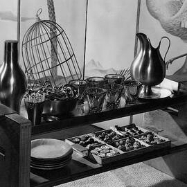 A Table With Tableware And Snacks by The 3