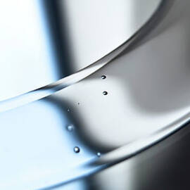 An Abstract Shiny Silver Surface With by Ralf Hiemisch