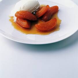Apricots Served With Vanilla Ice Cream by Romulo Yanes