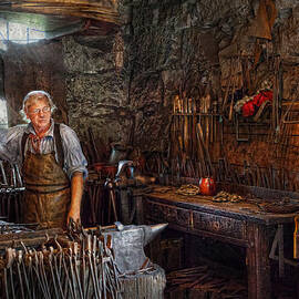 Blacksmith - Working the forge  by Mike Savad