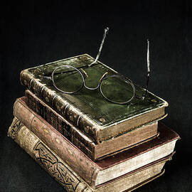 books with glasses by Joana Kruse