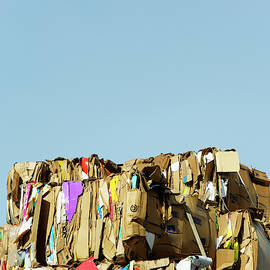 Bundles Of Compressed Cardboard Ready by Ron Koeberer
