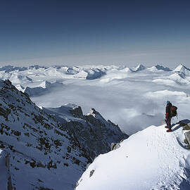 Climber On The Summit Of Mt Shinn by Colin Monteath