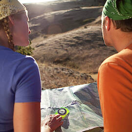 Couple Using A Map While by Jordan Siemens