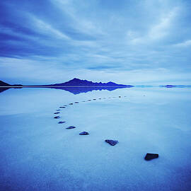 Curved Stone Pathway In Calm Lake At by Thomas Barwick