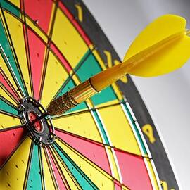 Dart On A Dartboard by Visage