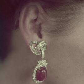 Ear Of A Model With A Ruby Earring by Richard Rutledge