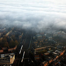 Elevated View Of City And Train Line In by Gary Yeowell