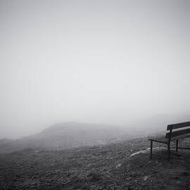 Empty bench in the fog black and white photo by Matthias Hauser