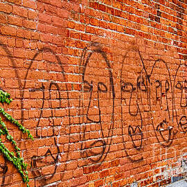 Faces on the bricks by Jim Lepard