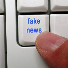 Fake News Key On A Computer Keyboard by Science Photo Library