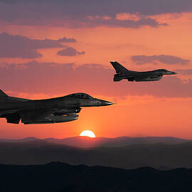 Fıghter Jet In Flight At Sunset by Guvendemir
