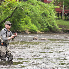Fisherman Using Angling Technique by Dustin Doskocil