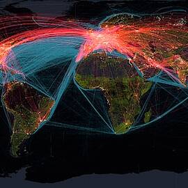 Global Transport Networks On Night Map by Science Photo Library