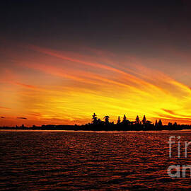 Golden sunrise over coastal lake by Geoff Childs