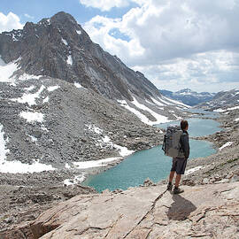 Hiker Enjoys The Views Above The Darwin by Adam Clark