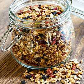 Homemade granola in glass jar by Elena Elisseeva