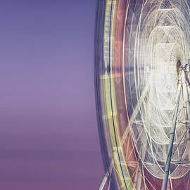 Illuminated Motion Ferris Wheel At by Aaaaimages