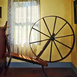 Large Spinning Wheel Near Lace Curtain by Susan Savad