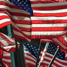 Layers Of American Flags Wave In Bright by Peskymonkey