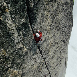Man Climbs Steep Crack In The Bugaboos by Andrew Querner