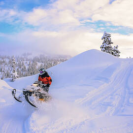Man Jumping On Snowmobile In Callaghan by Alex Eggermont