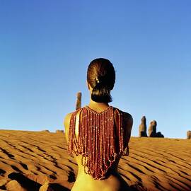 Model Wearing A Red Beaded Necklace by John Cowan