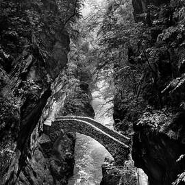 Monochrome image of the stone bridge in the Val d'Areuse by Charles Lupica