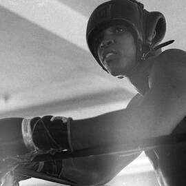 Muhammad Ali Gloves Resting On Ropes by Retro Images Archive
