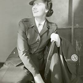 Portrait Of Katherine Blake In Her Red Cross by Horst P. Horst