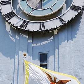The Ferry Terminal Clock And The Flag Of San Francisco by Marcus Dagan