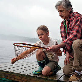 Senior Man Looking At Empty Net by Monica Donovan