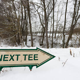 Sign next tee on golf course in winter
