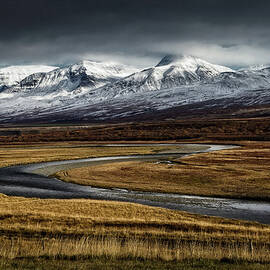 Snow-covered Mountains In Hof, Iceland by Anna Gorin
