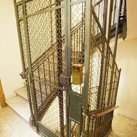 Stairway And Traditional Lift In Apartment by Science Photo Library