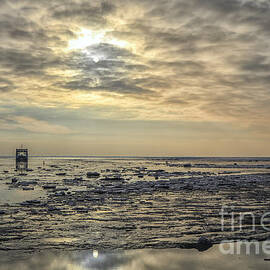 Sunset on a wadden sea with ice by Patricia Hofmeester