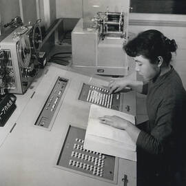 ?THE BRAIN? WORKS IN JAPANESE: TOKYO BUSINESSMEN USE NEW SERVICE TO ASSIST THEM IN CALCULATION S AND ESTIMATES by Retro Images Archive