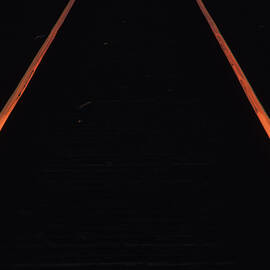 The Rails Of A Train Track In Montreal by Dan Rafla