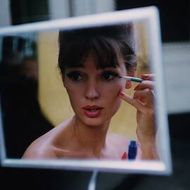 The Reflection Of A Model Applying Make-up by Karen Radkai